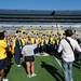 Members of the Michigan marching band stand together as they wait to record vocals for a Pure Michigan video shoot at Michigan Stadium on Wednesday. Melanie Maxwell I AnnArbor.com